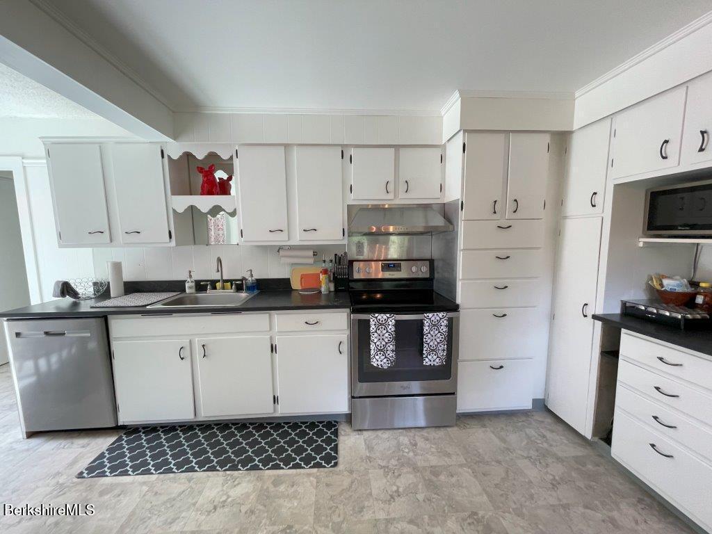 193 South Mountain Road Pittsfield, MA 01201 - Photo 11 of 49 a kitchen with granite countertop a sink cabinets and stainless steel appliances