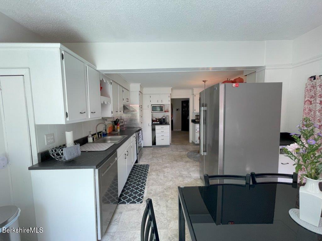 193 South Mountain Road Pittsfield, MA 01201 - Photo 13 of 49 a kitchen with stainless steel appliances granite countertop a refrigerator a stove and a sink