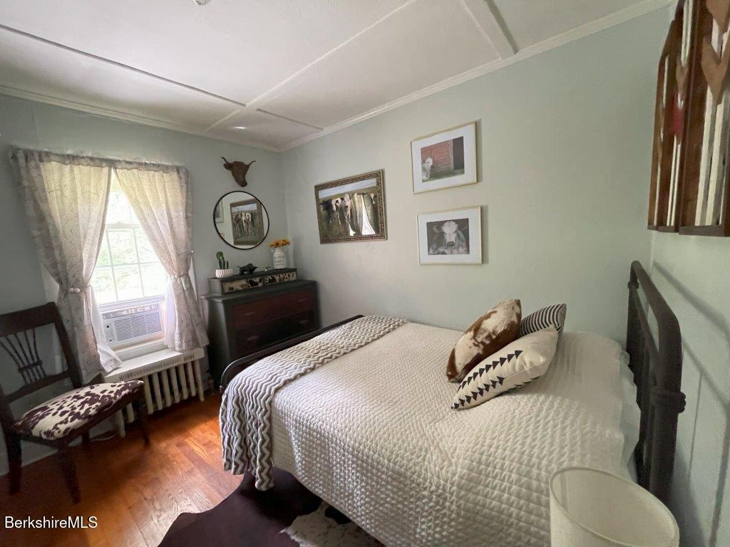 193 South Mountain Road Pittsfield, MA 01201 - Photo 17 of 49 a bedroom with a bed and a tv on table