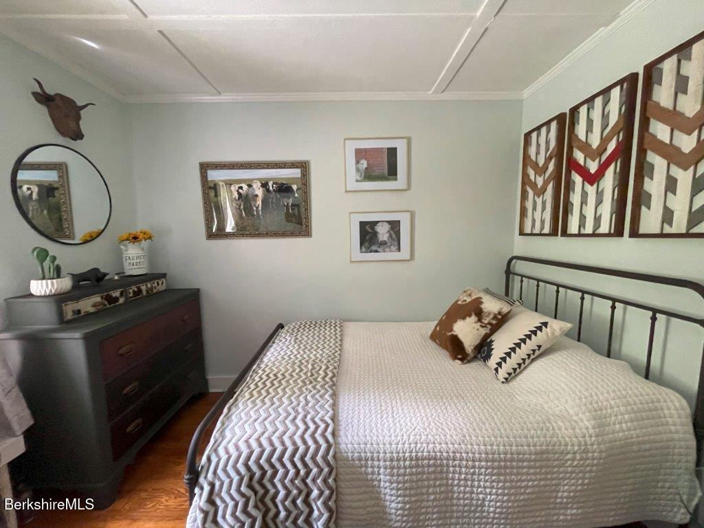 193 South Mountain Road Pittsfield, MA 01201 - Photo 18 of 49 a bedroom with a bed and wooden floor