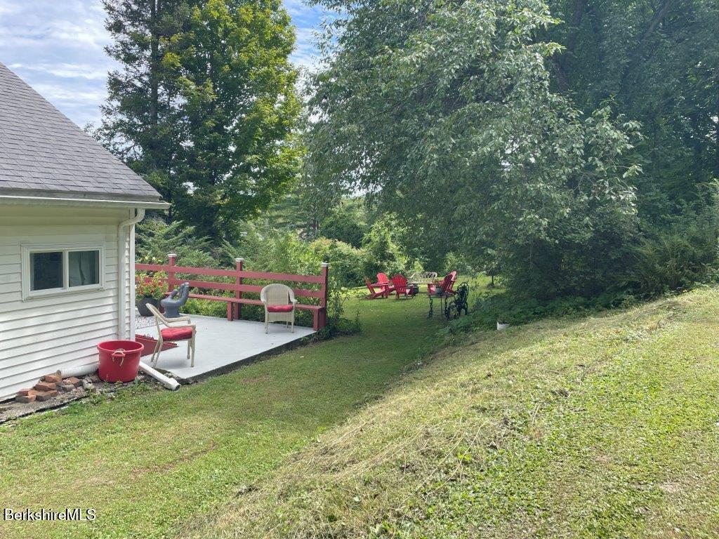 193 South Mountain Road Pittsfield, MA 01201 - Photo 28 of 49 a view of a backyard with a table and chair