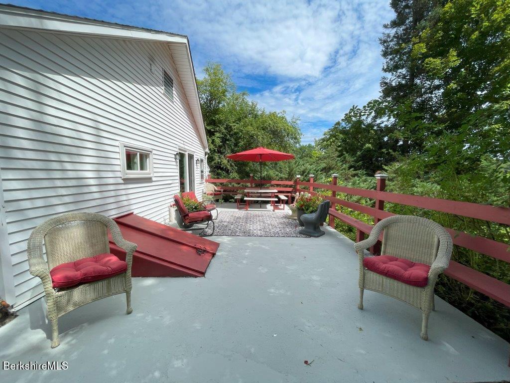 193 South Mountain Road Pittsfield, MA 01201 - Photo 31 of 49 a backyard of a house with outdoor seating