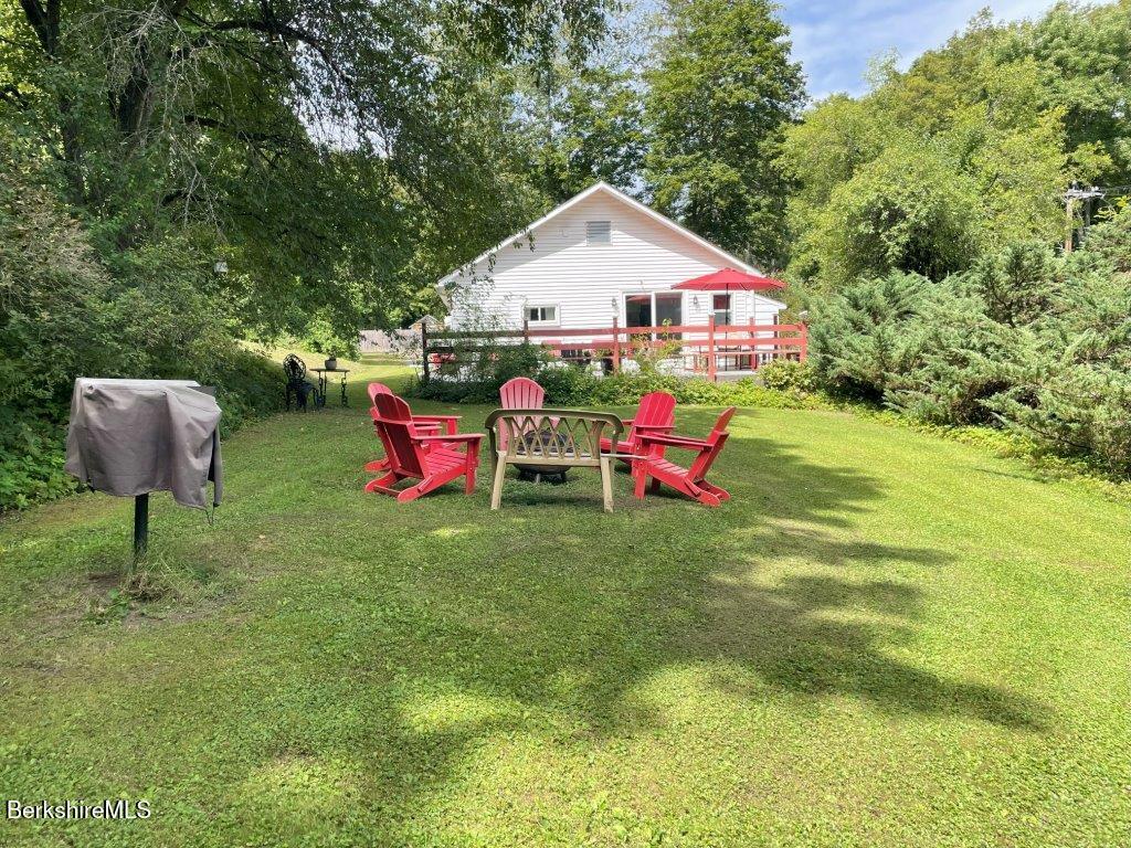 193 South Mountain Road Pittsfield, MA 01201 - Photo 37 of 49 a backyard of a house with table and chairs