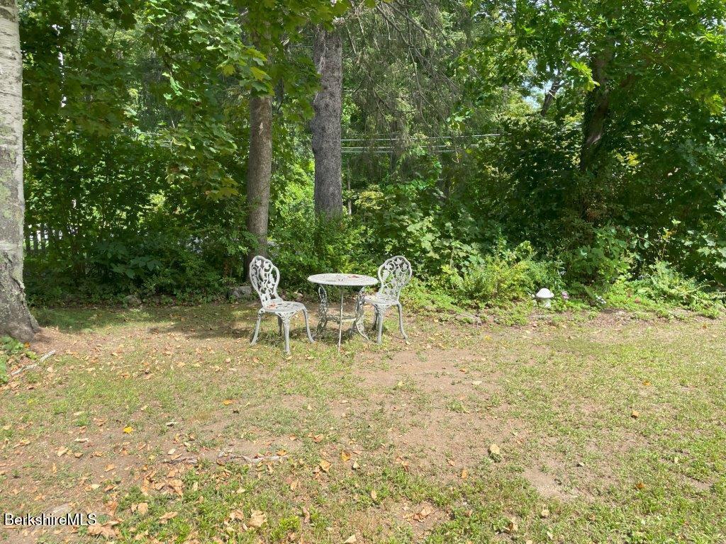 193 South Mountain Road Pittsfield, MA 01201 - Photo 43 of 49 a white bench sitting in a forest