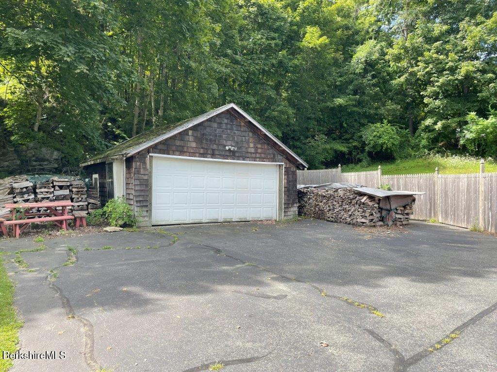 193 South Mountain Road Pittsfield, MA 01201 - Photo 46 of 49 a front view of a house with a yard and garage