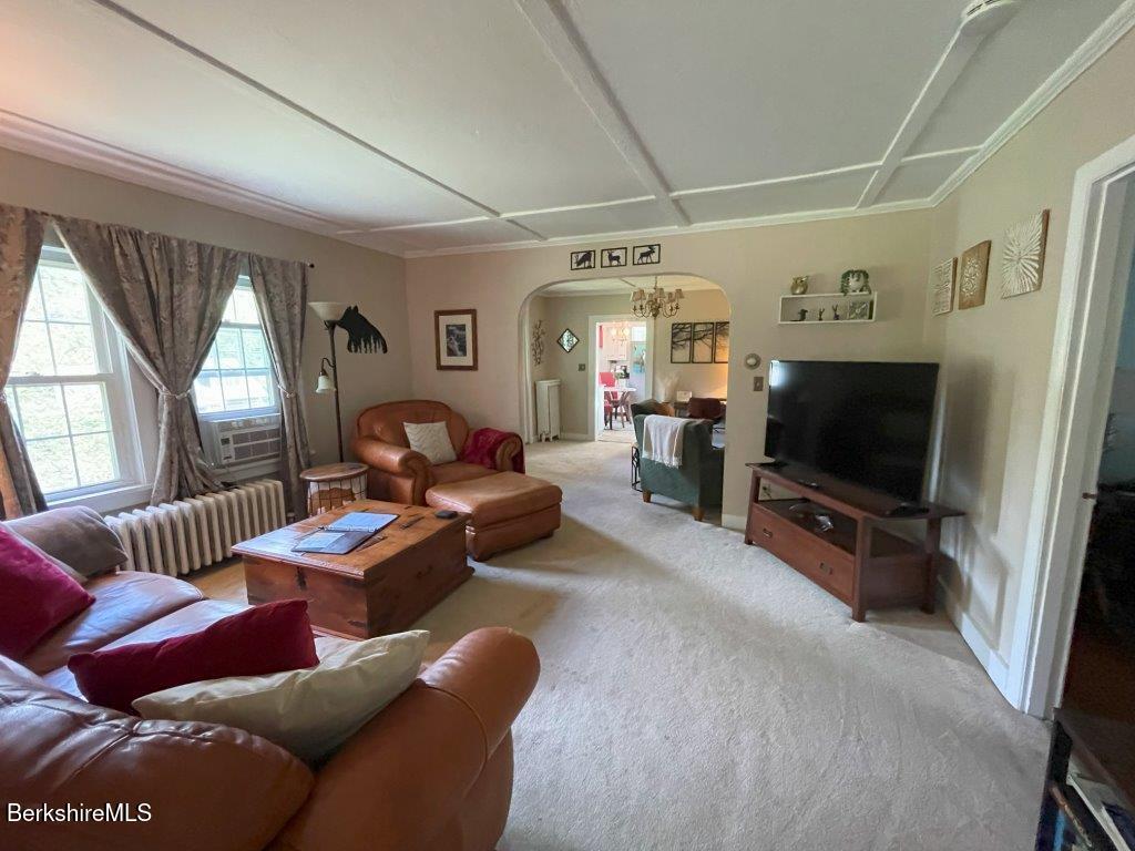 193 South Mountain Road Pittsfield, MA 01201 - Photo 6 of 49 a living room with furniture and a flat screen tv