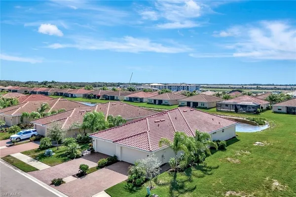 an aerial view of residential houses with outdoor space