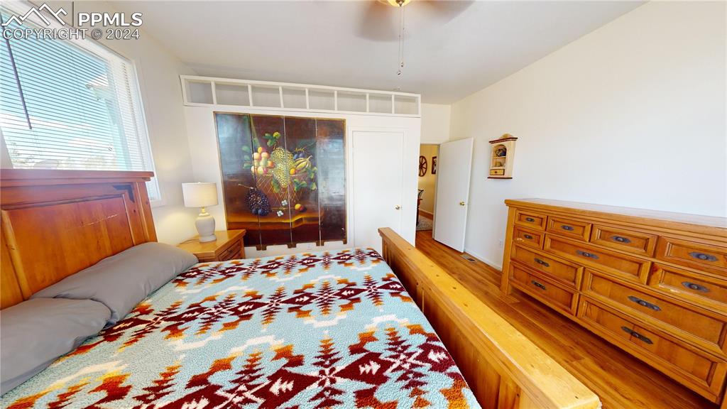 315 5th Street Victor, CO 80860 - Photo 21 of 39 a bedroom with a bed and wooden floor