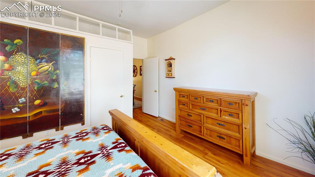 315 5th Street Victor, CO 80860 - Photo 22 of 39 a bedroom with a bed and a dresser in it