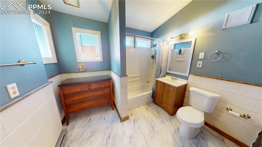 315 5th Street Victor, CO 80860 - Photo 25 of 39 a bedroom with a bed and a couch