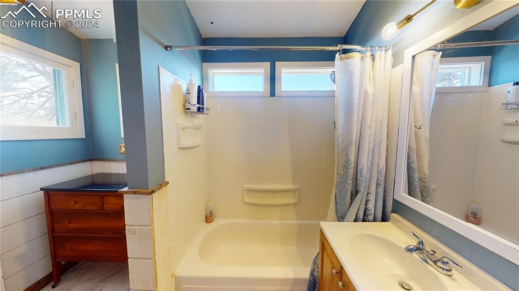 315 5th Street Victor, CO 80860 - Photo 26 of 39 a bathroom with a tub and shower
