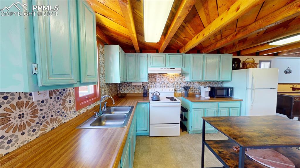 315 5th Street Victor, CO 80860 - Photo 8 of 39 a kitchen with a wooden table and chairs