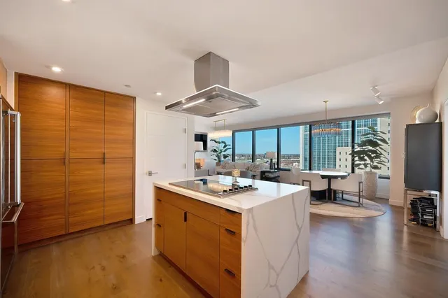 a kitchen with a sink cabinets and window