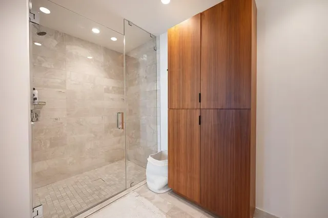 a living room with fireplace furniture and a chandelier
