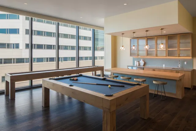 a view of backyard with swimming pool and outdoor seating