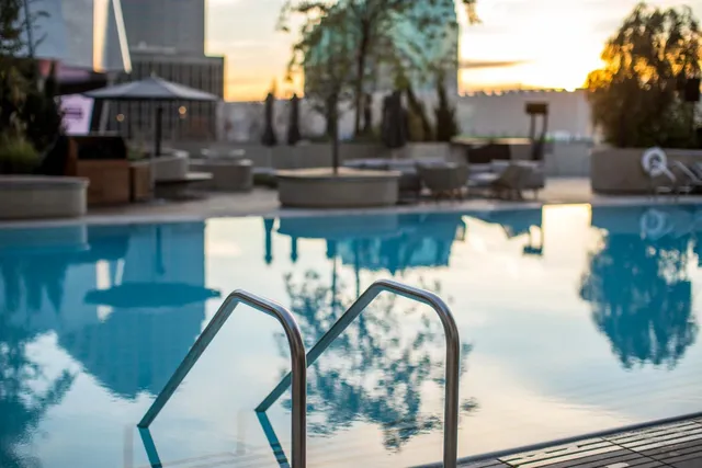 a view of a chairs and table in the back yard of the house