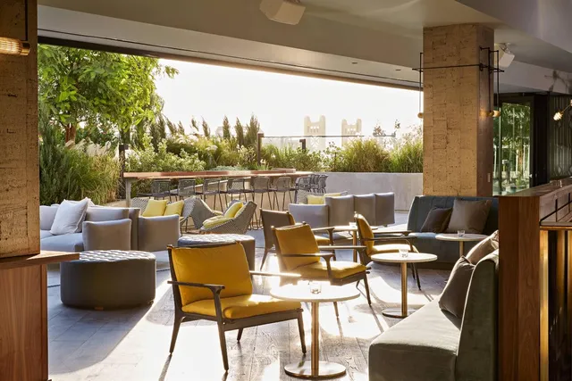 a view of swimming pool with furniture