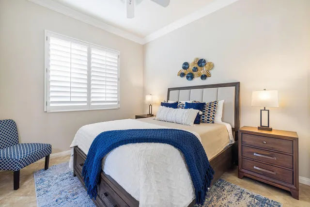 a bed room with a bed and a window