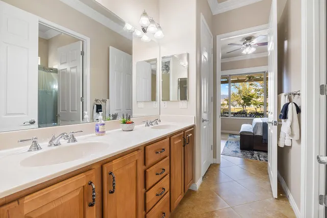 a bathroom with a double vanity sink and a mirror