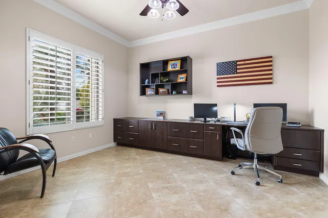 a workspace with furniture and a window