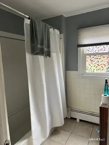 a view of walk in closet with window