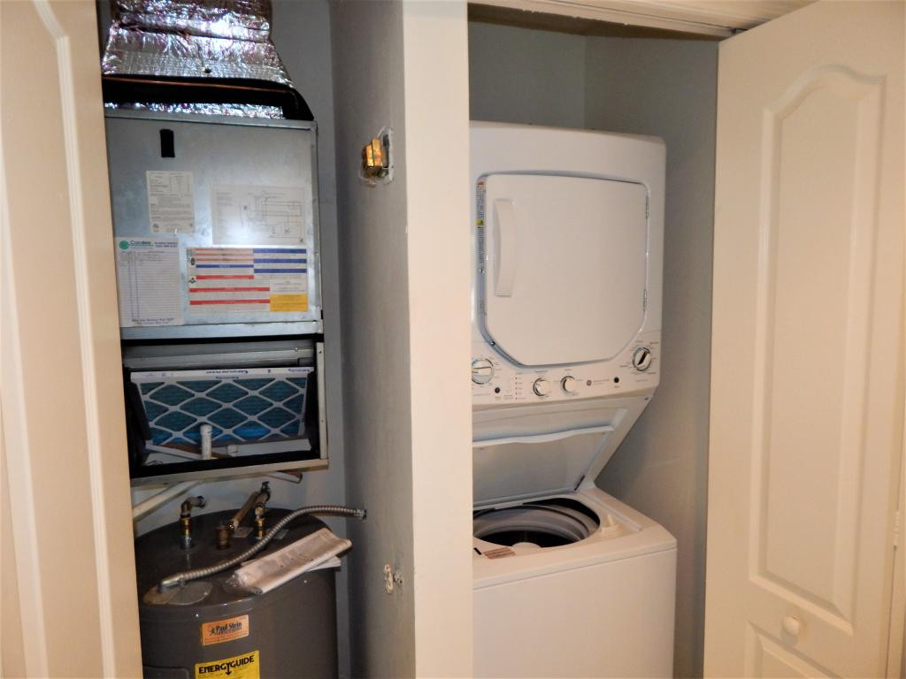 8065 Tiger Cove, Unit 1610 Naples, FL 34113 - Photo 11 of 11 a bathroom with a toilet and a sink