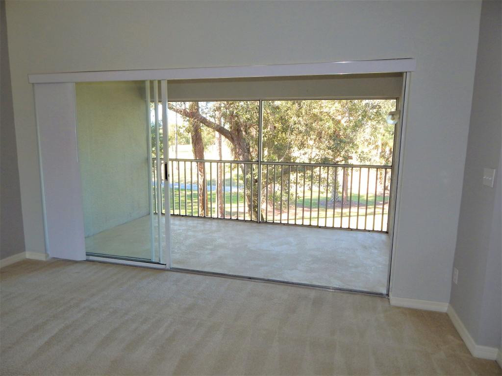 8065 Tiger Cove, Unit 1610 Naples, FL 34113 - Photo 5 of 11 a view of an empty room with a window