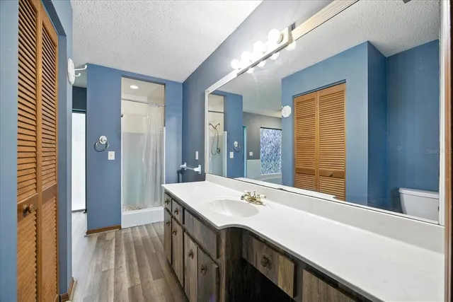 a spacious bathroom with a bathtub and a shower