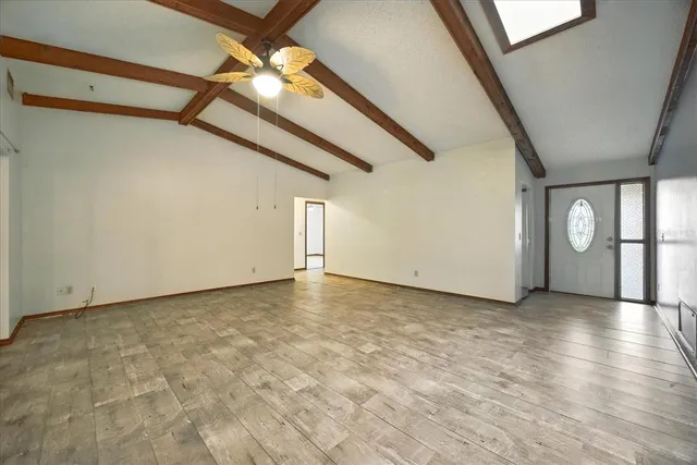 a view of an empty room with a window