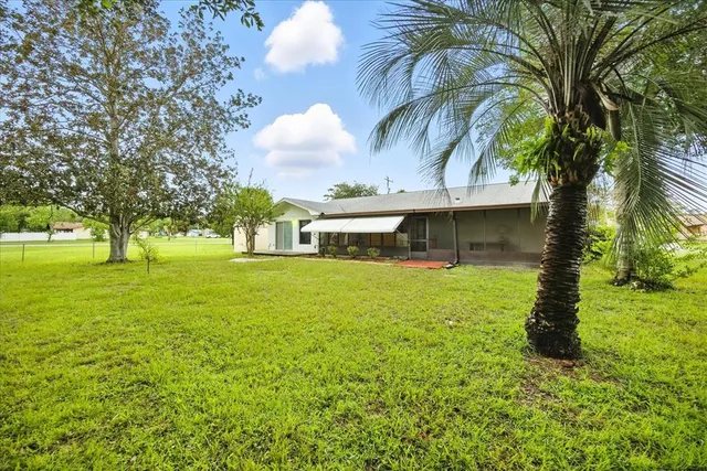 a house view with swimming pool