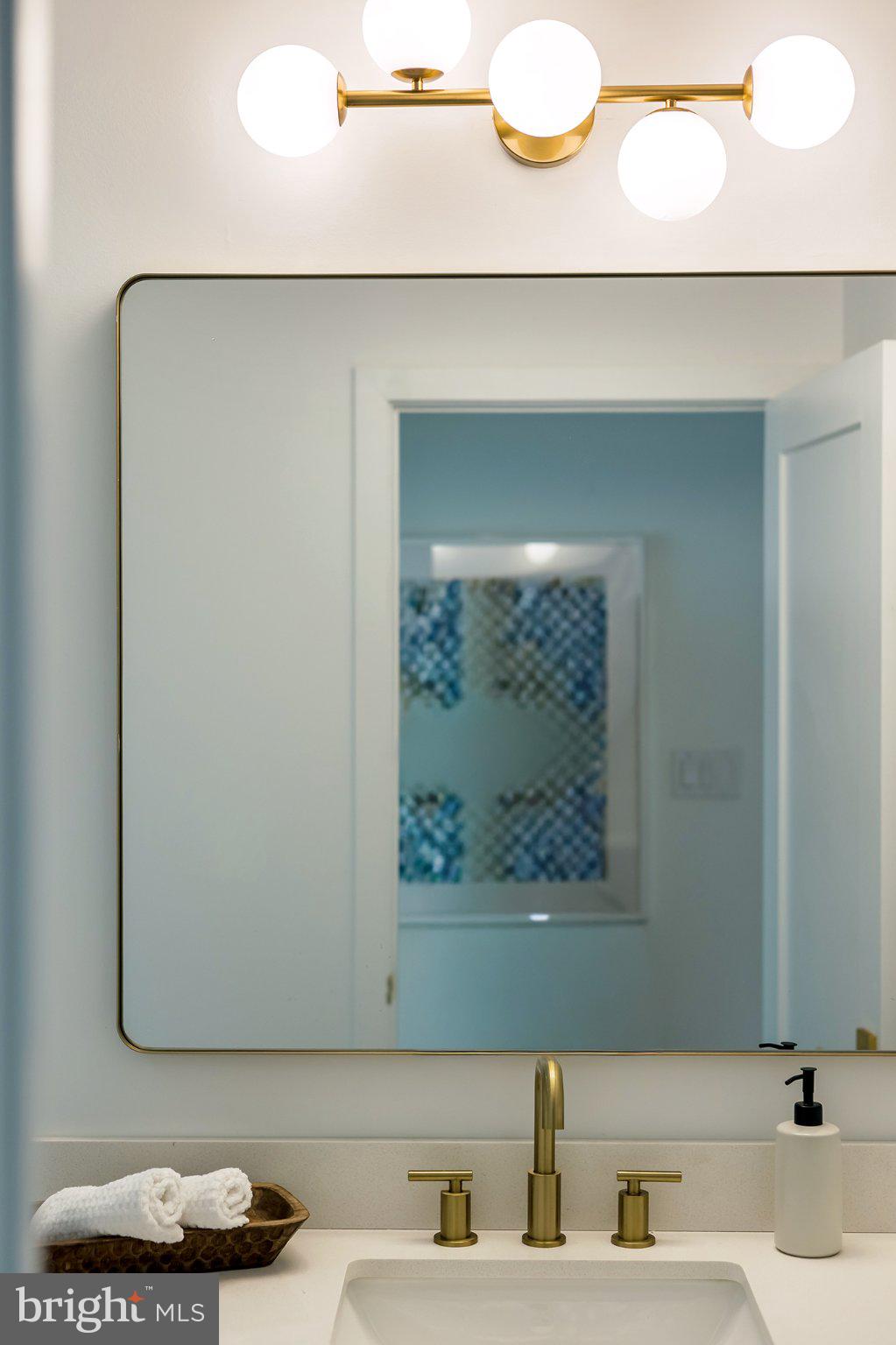 1212 4th Street Northwest, Unit 9 Washington, DC 20001 - Photo 39 of 42 a bathroom with a sink and a mirror
