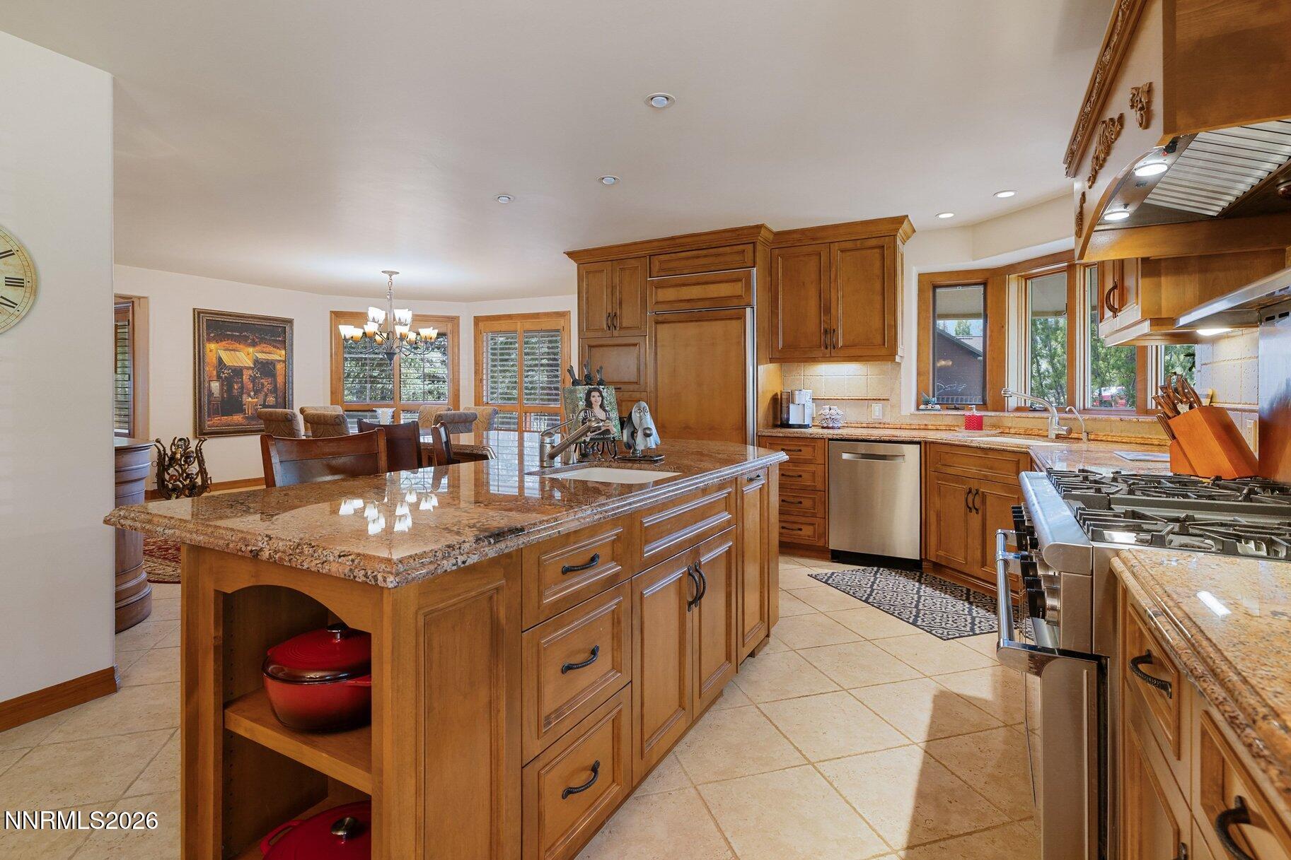 360 Sylvan Court Verdi, NV 89439 - Photo 11 of 76 a kitchen with stainless steel appliances granite countertop a sink stove and cabinets