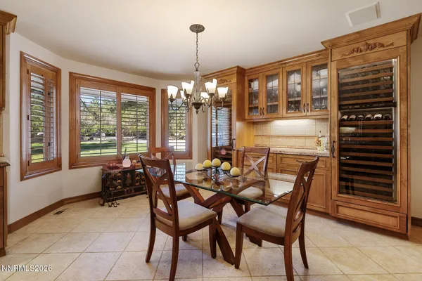 a living room with furniture a flat screen tv and a window