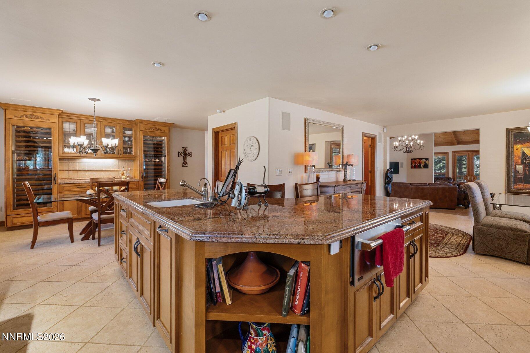360 Sylvan Court Verdi, NV 89439 - Photo 16 of 76 a dining hall with stainless steel appliances granite countertop a stove and a dining table view