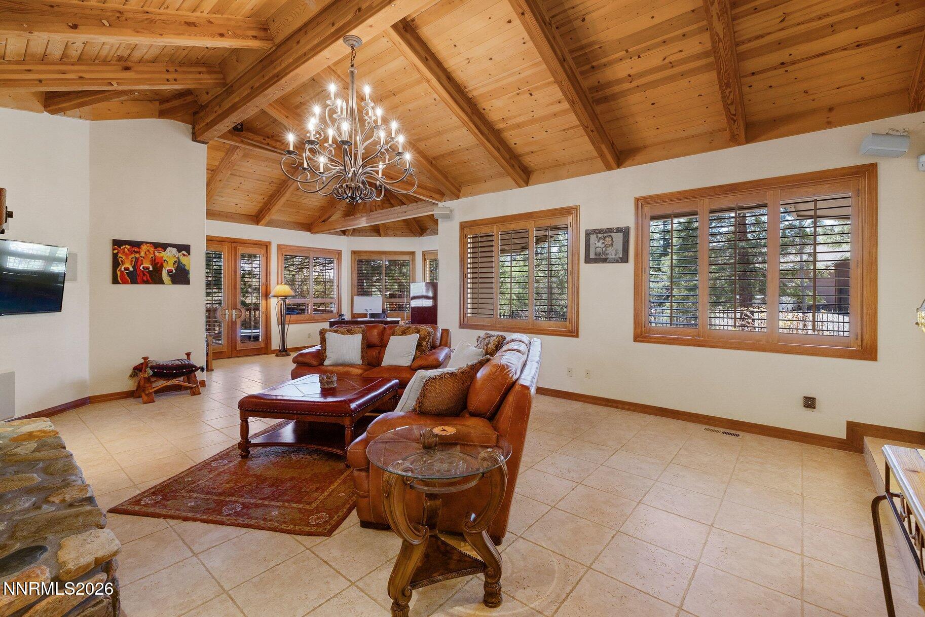 360 Sylvan Court Verdi, NV 89439 - Photo 19 of 76 a living room with furniture a chandelier and a large window