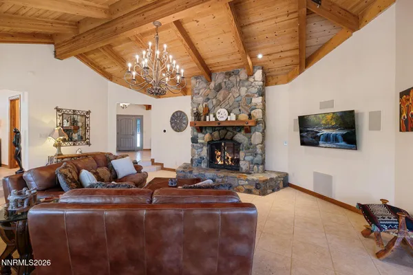 a bathroom with a granite countertop tub sink and mirror