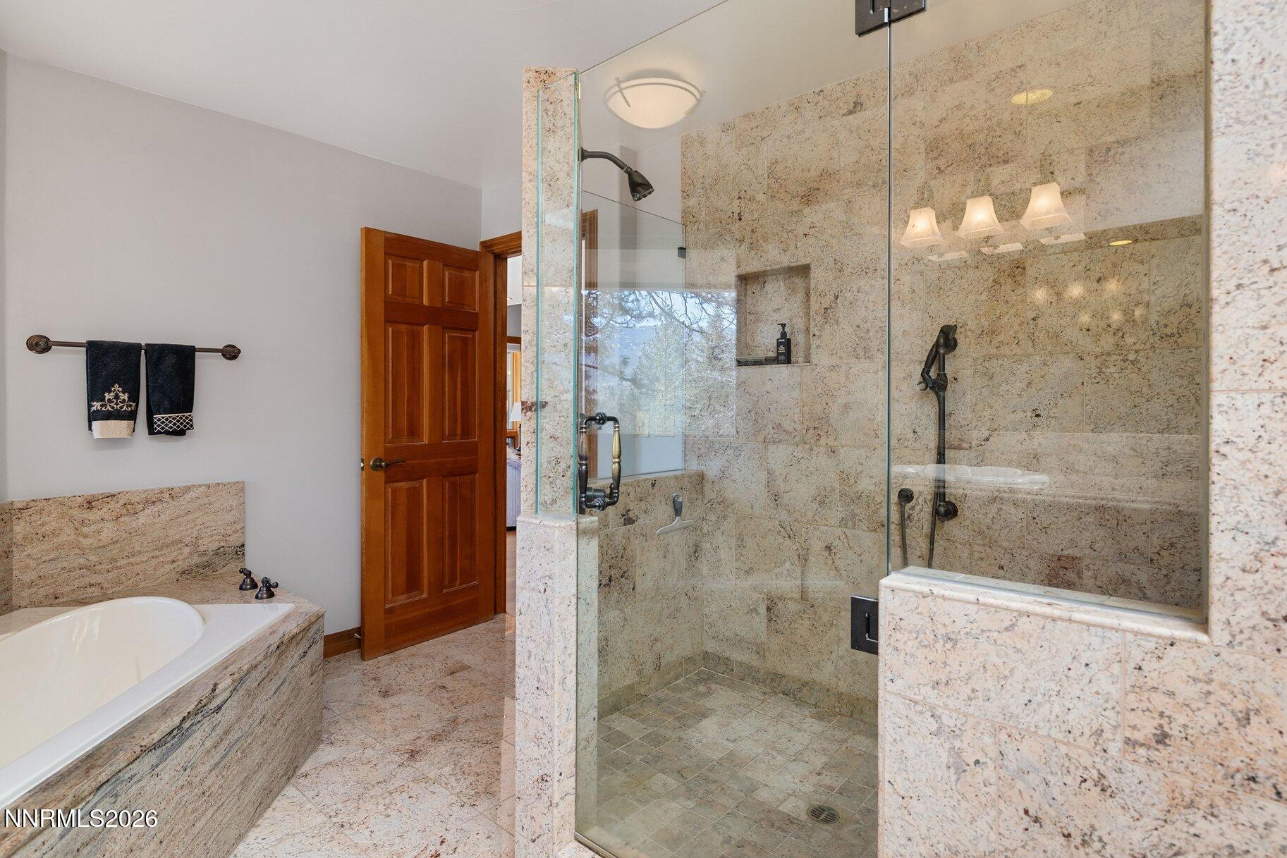 360 Sylvan Court Verdi, NV 89439 - Photo 29 of 76 a bathroom with a bathtub and a shower