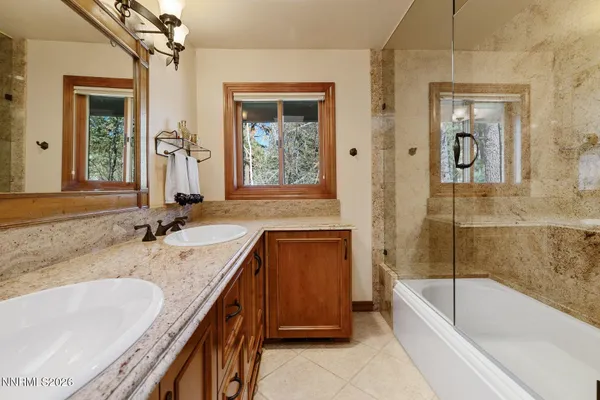 a front view of a house with swimming pool having outdoor seating