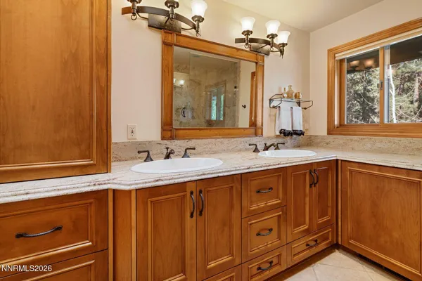 a couple of table and chairs in front of house