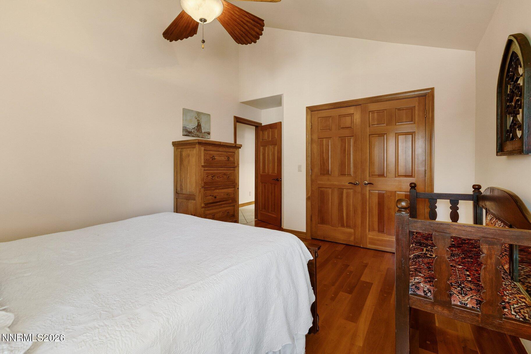 360 Sylvan Court Verdi, NV 89439 - Photo 35 of 76 a bedroom with a bed and a chandelier