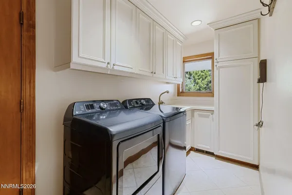 a view of a lush green hillside and houses
