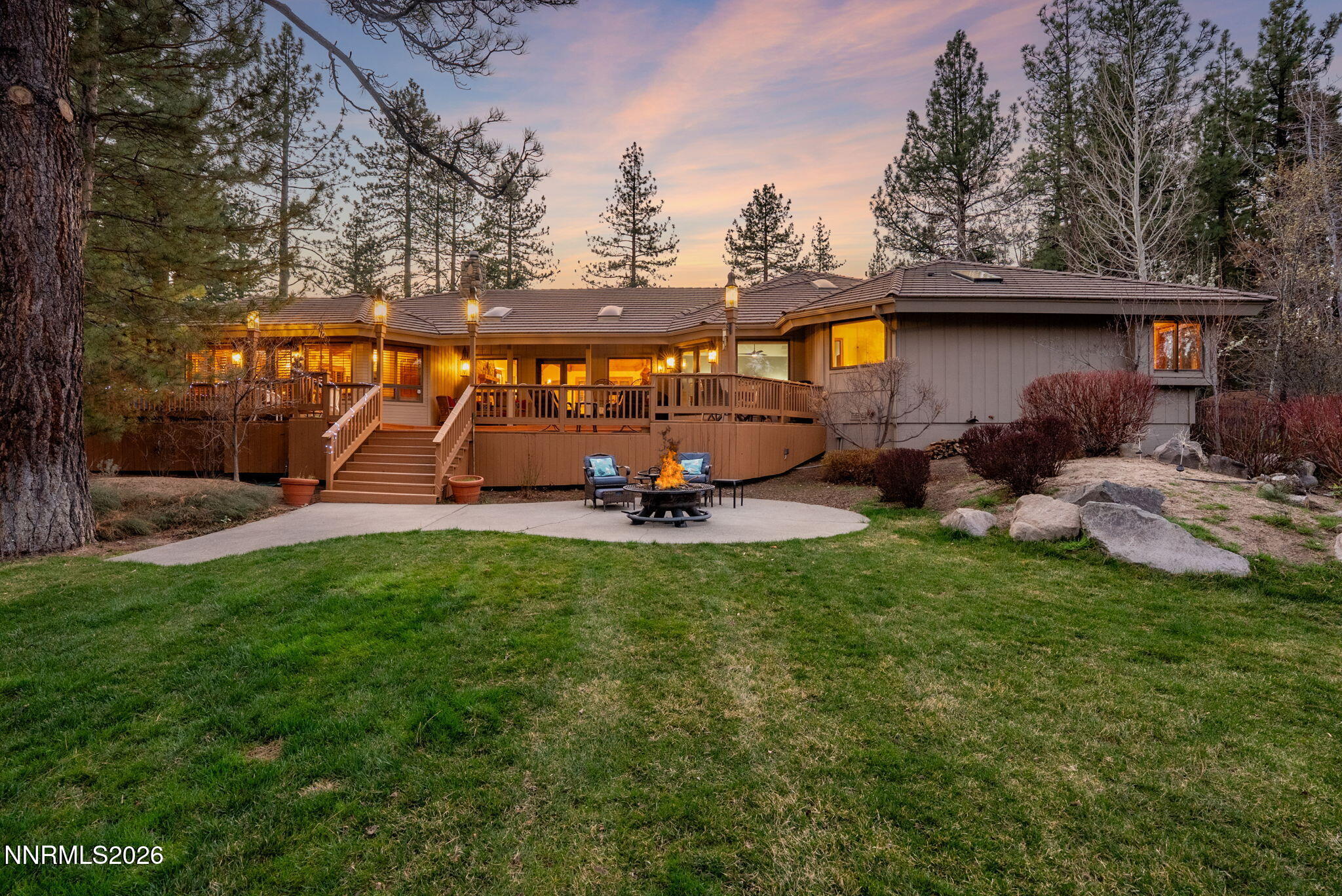 360 Sylvan Court Verdi, NV 89439 - Photo 47 of 76 a view of a backyard with table and chairs potted plants and a large tree