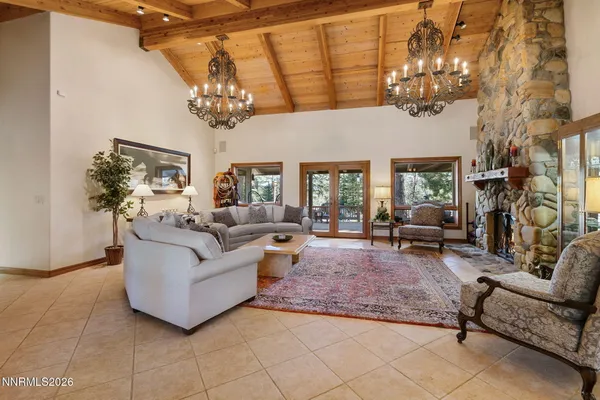 a living room with furniture a clock and a fireplace