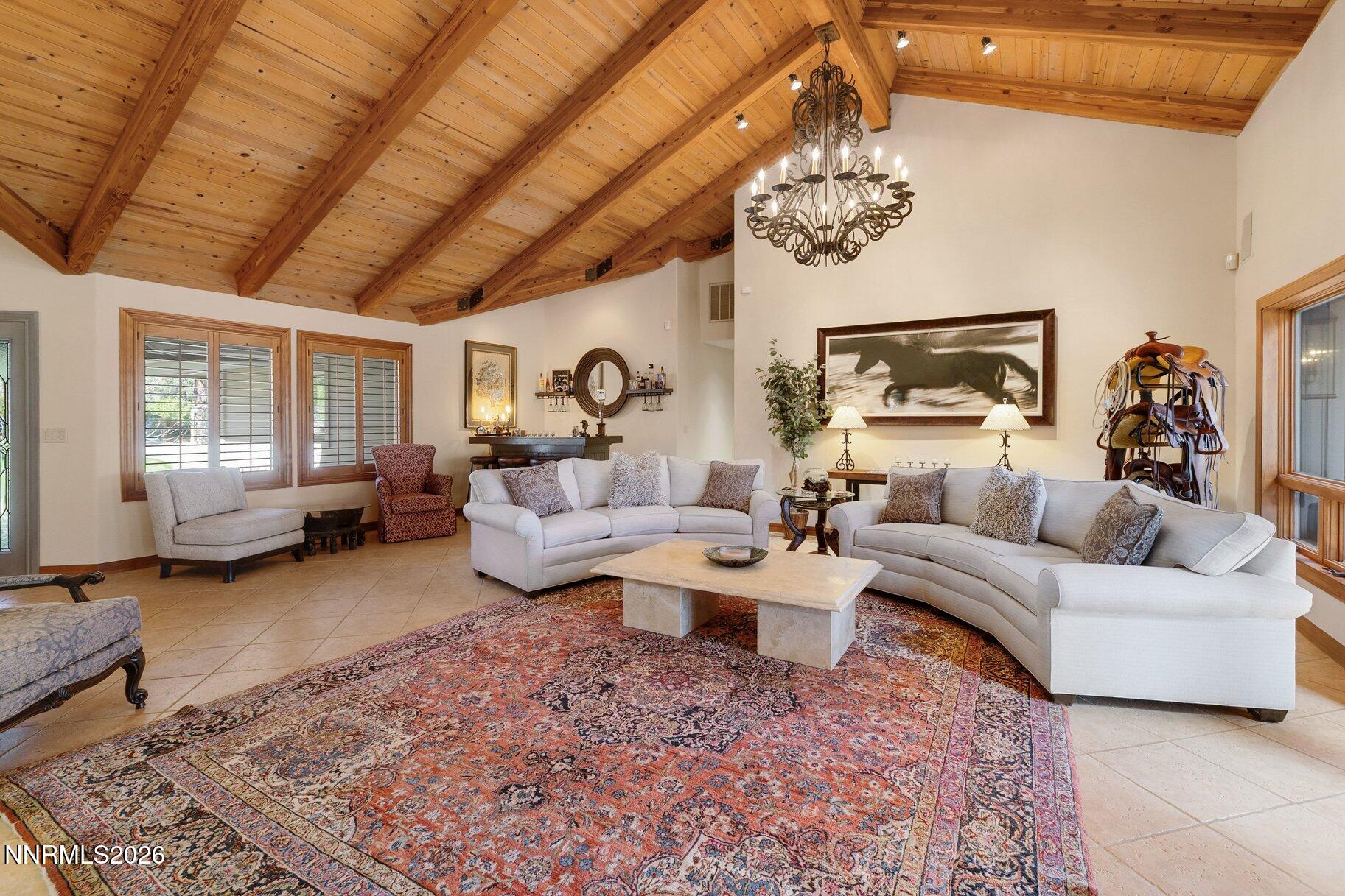 360 Sylvan Court Verdi, NV 89439 - Photo 8 of 76 a living room with furniture and a chandelier