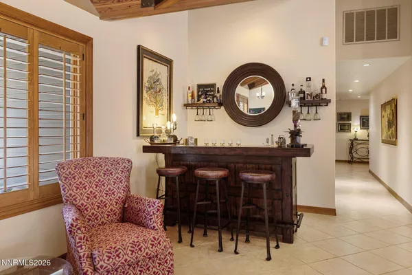 a kitchen with stainless steel appliances granite countertop a stove a sink and a dining table