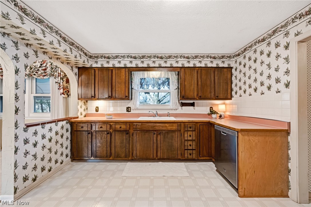 6452 Carsten Road Medina, OH 44256 - Photo 11 of 41 Kitchen with sink, dishwasher, and light tile floors
