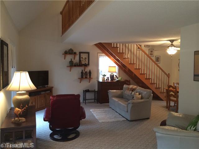 690 Bandy Road Star, NC 27356 - Photo 2 of 16 Living Room. Huge living room with full length windows, exposed stairwell, and open to the dining room!