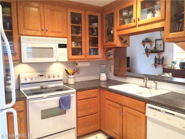690 Bandy Road Star, NC 27356 - Photo 5 of 16 Kitchen. Kitchen has lots of custom cabinetry, eat at bar and view through glass front cabinets! All appliances included!