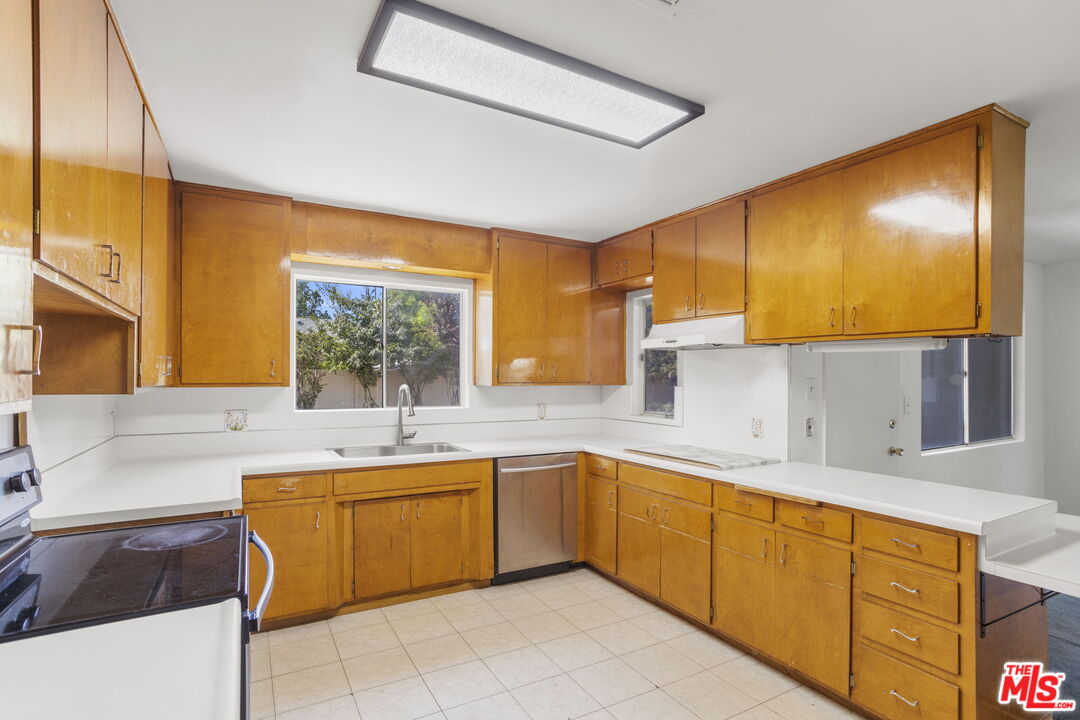 5279 Falkirk Avenue Riverside, CA 92506 - Photo 15 of 44 a kitchen with a sink and cabinets