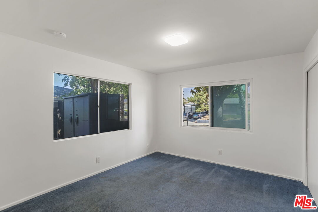 5279 Falkirk Avenue Riverside, CA 92506 - Photo 21 of 44 an empty room with windows